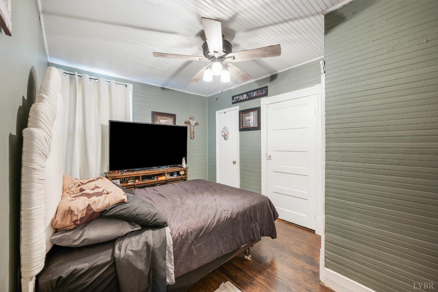 342 Toll Gate Road Concord, VA 24538 - Photo 14 of 48 a bedroom with a bed and a flat screen tv