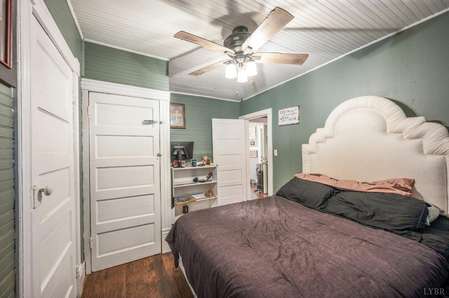 342 Toll Gate Road Concord, VA 24538 - Photo 15 of 48 a bedroom with a bed and a ceiling fan