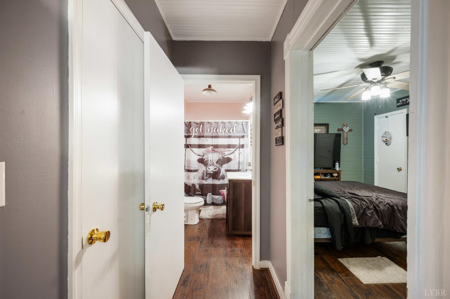342 Toll Gate Road Concord, VA 24538 - Photo 16 of 48 a view of a hallway with a livingroom and a dinning area with furniture