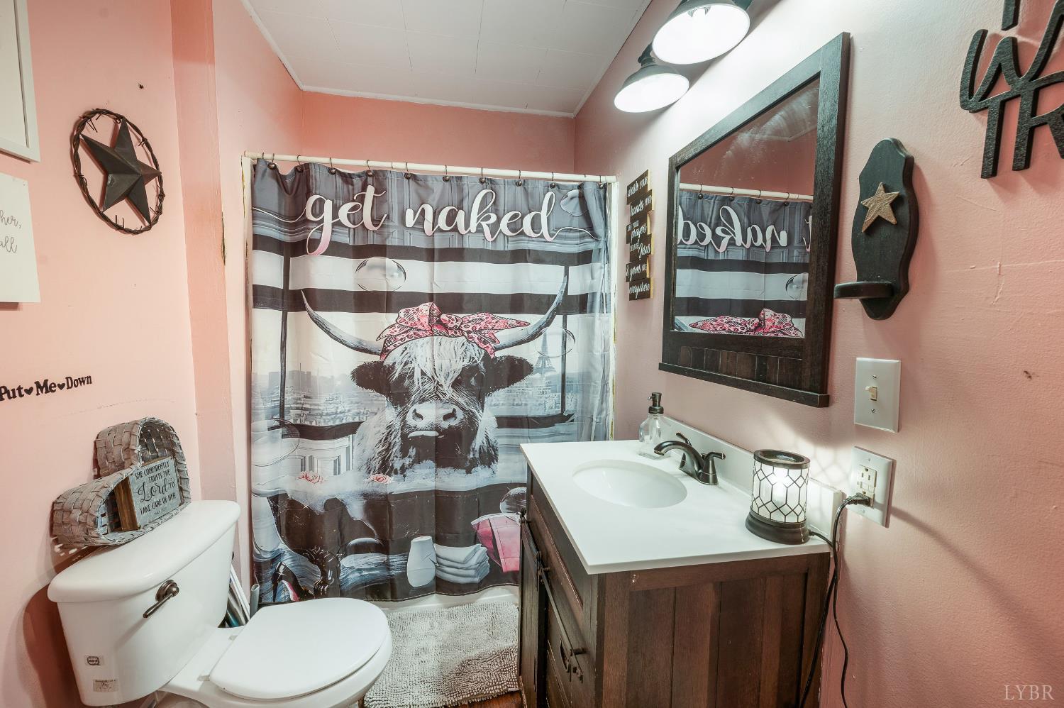 342 Toll Gate Road Concord, VA 24538 - Photo 17 of 48 a bathroom with a toilet sink and mirror