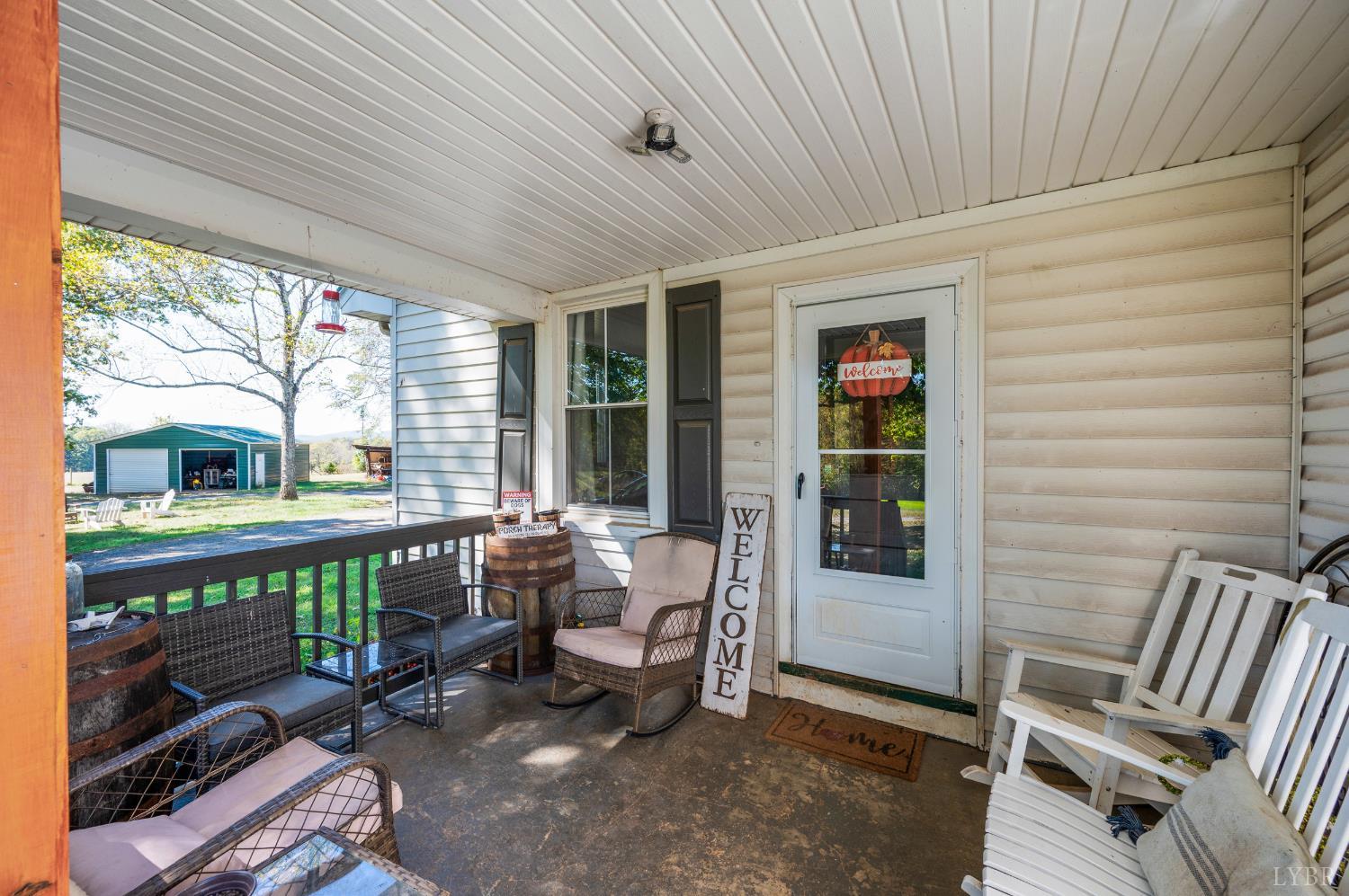 342 Toll Gate Road Concord, VA 24538 - Photo 3 of 48 a view of a patio with a table and chairs