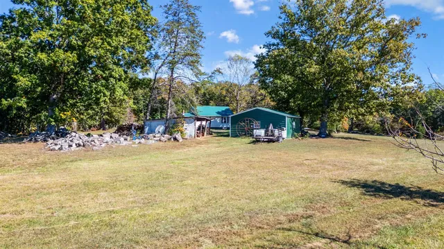 a view of a house with roof deck and sitting area