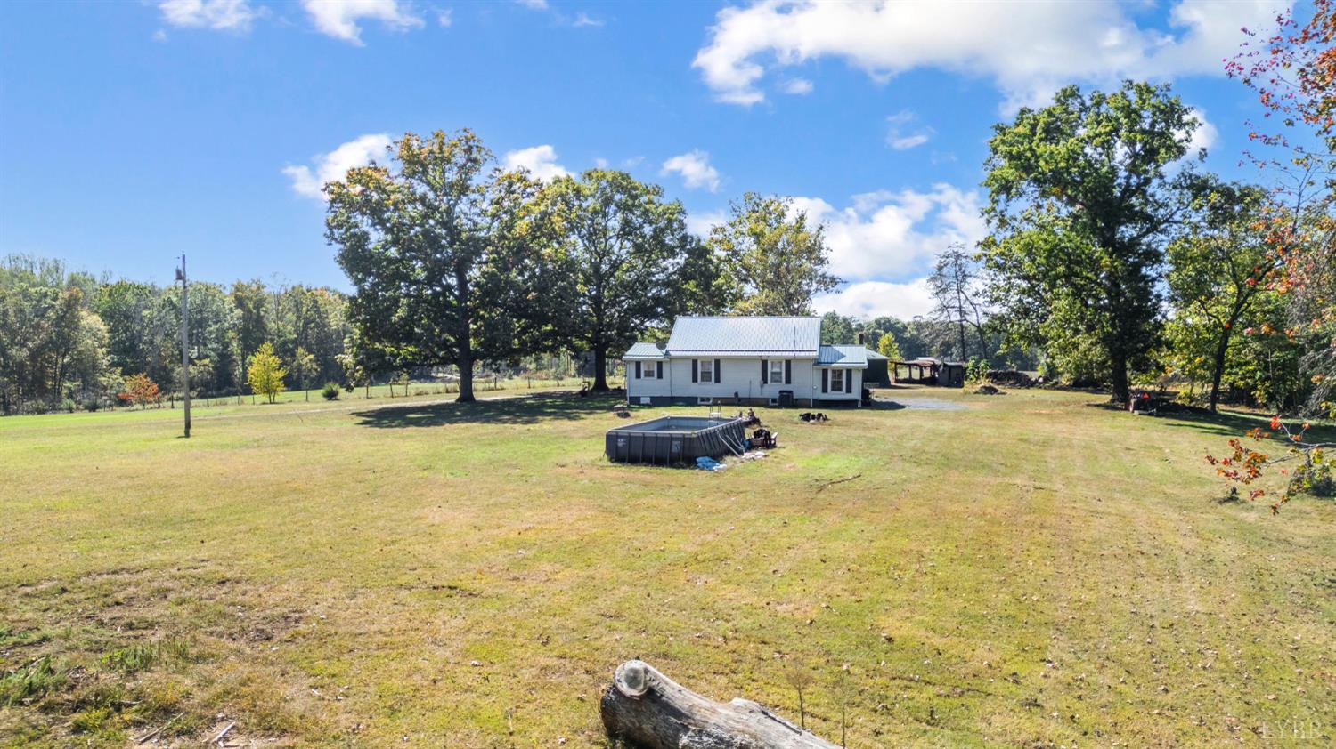 342 Toll Gate Road Concord, VA 24538 - Photo 39 of 48 a swimming pool with trees in the background