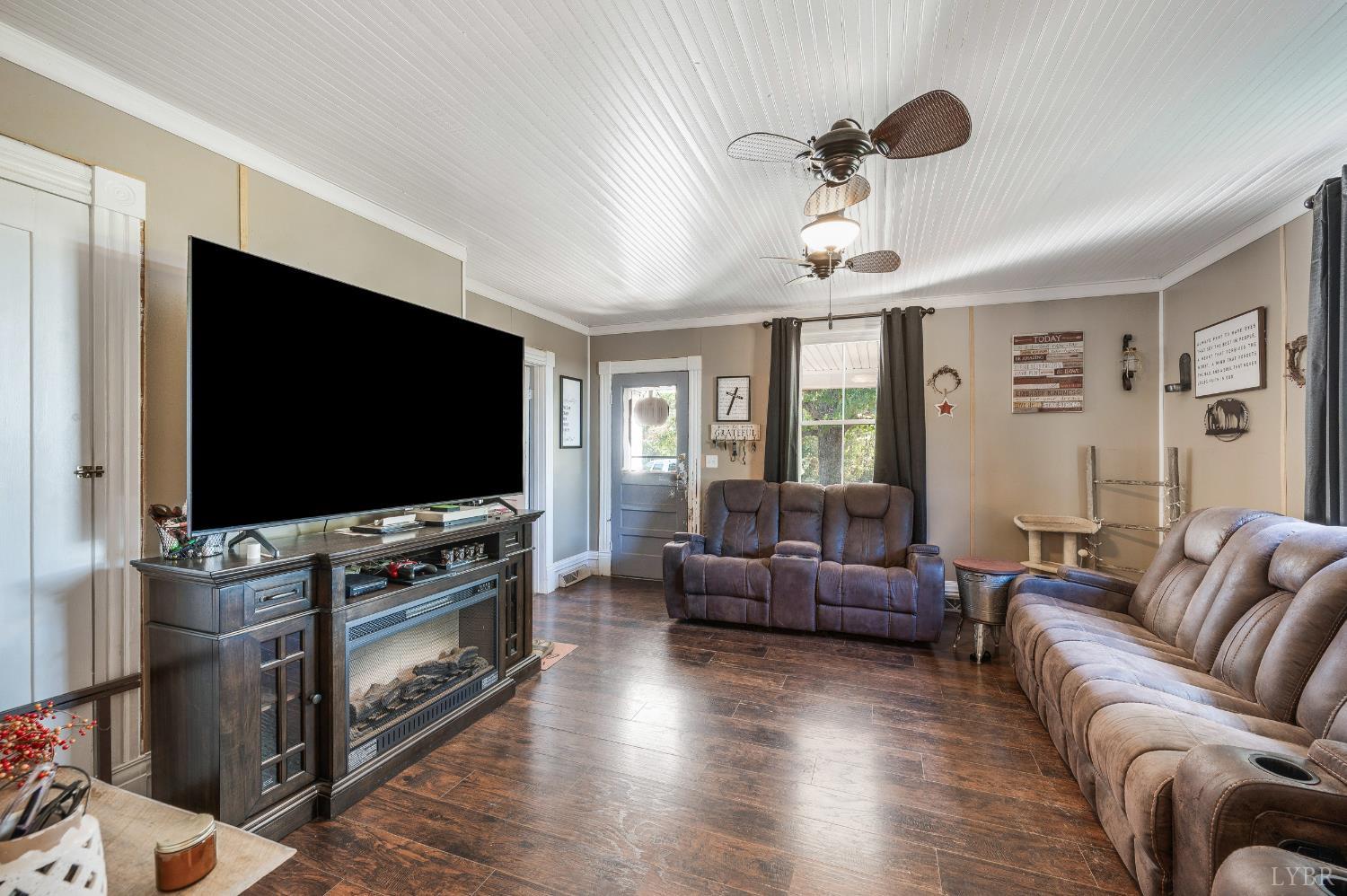 342 Toll Gate Road Concord, VA 24538 - Photo 5 of 48 a living room with furniture and a flat screen tv