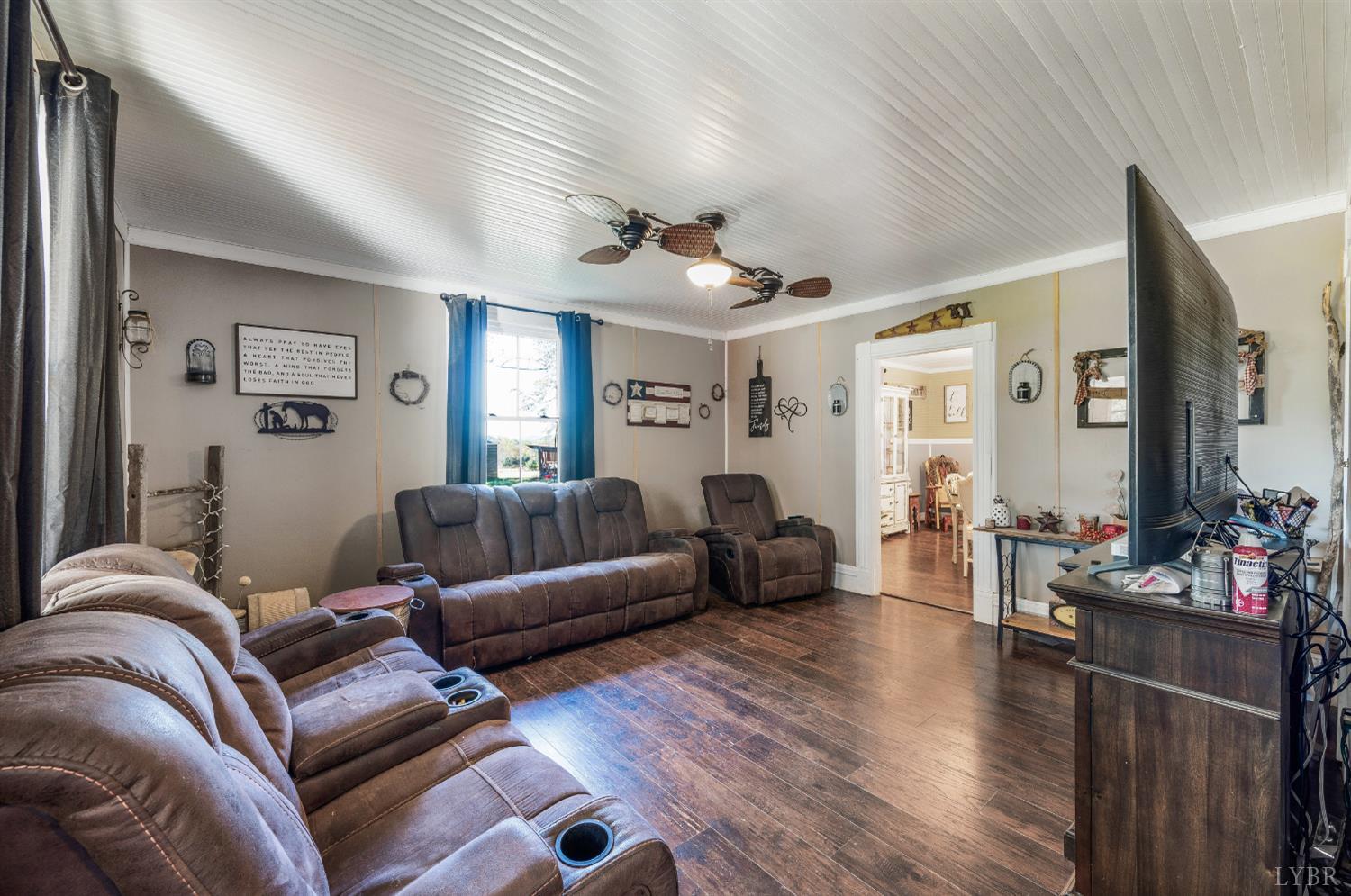 342 Toll Gate Road Concord, VA 24538 - Photo 6 of 48 a living room with furniture and wooden floor