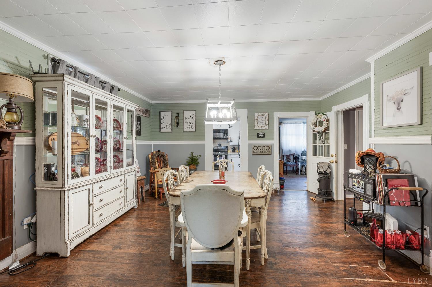 342 Toll Gate Road Concord, VA 24538 - Photo 7 of 48 a dining room with furniture a chandelier and wooden floor