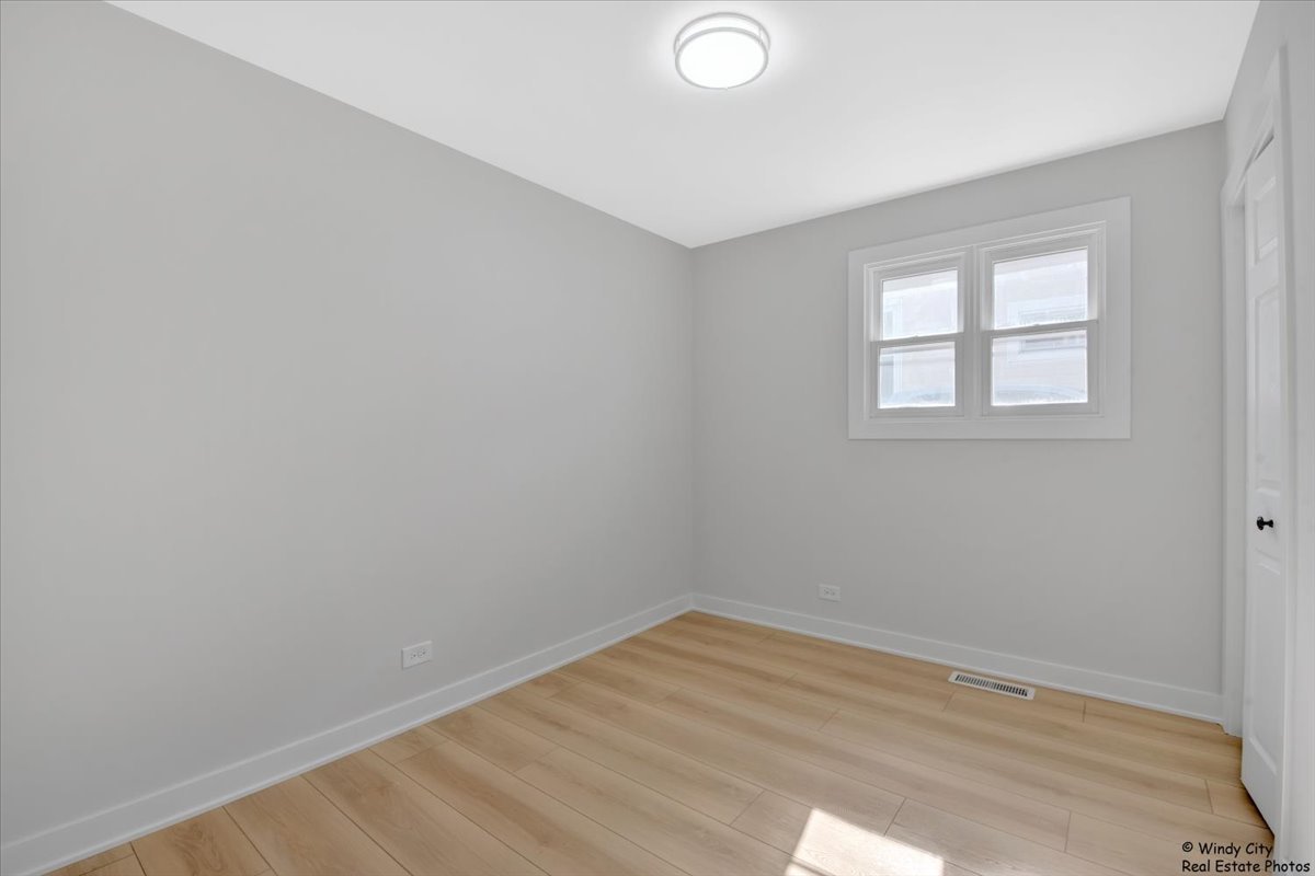 14914 Avers Avenue Midlothian, IL 60445 - Photo 16 of 22 an empty room with a window