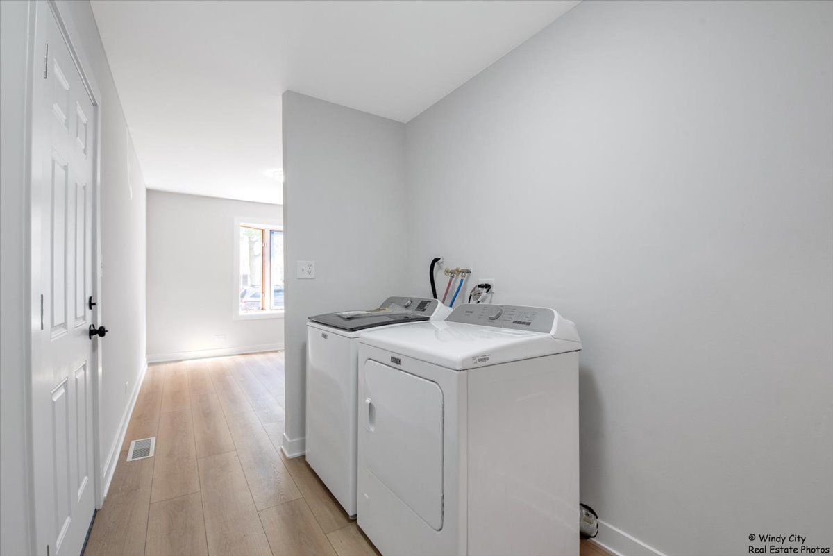 14914 Avers Avenue Midlothian, IL 60445 - Photo 19 of 22 a utility room with a sink dryer and washer