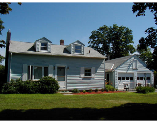 241 Turnpike Road Montague, MA 01376 - Photo 1 of 1 a front view of a house with a garden