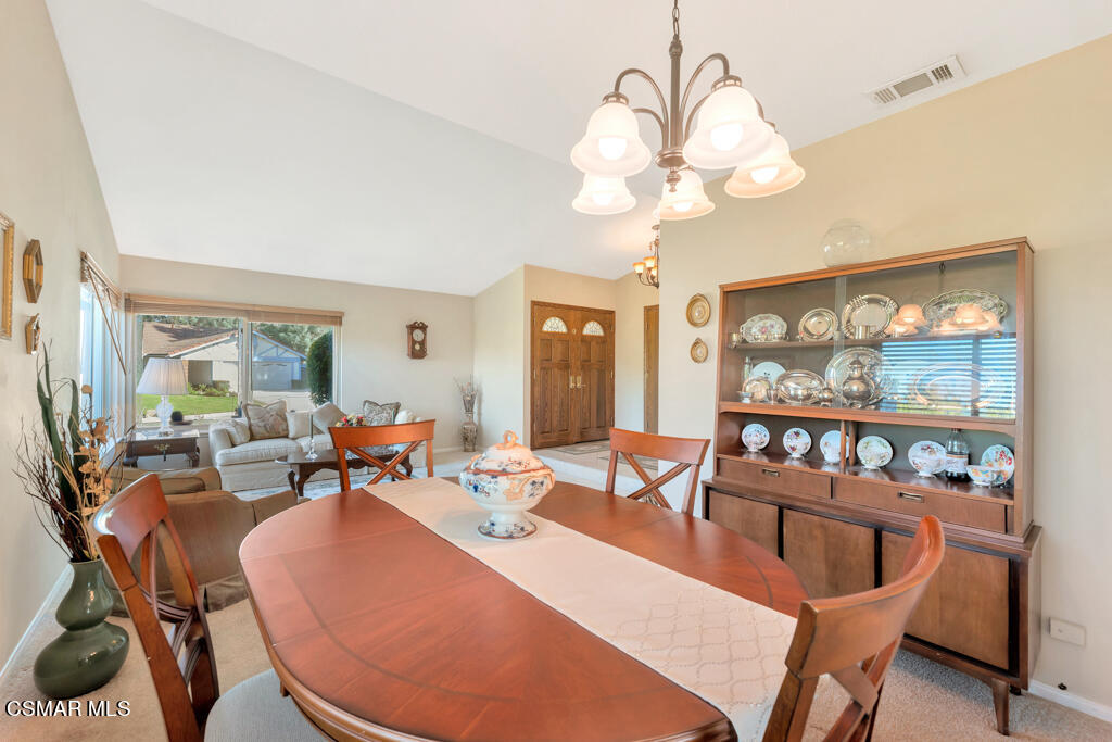 4331 Mill Valley Road Moorpark, CA 93021 - Photo 14 of 40 a living room with furniture a large window and a chandelier