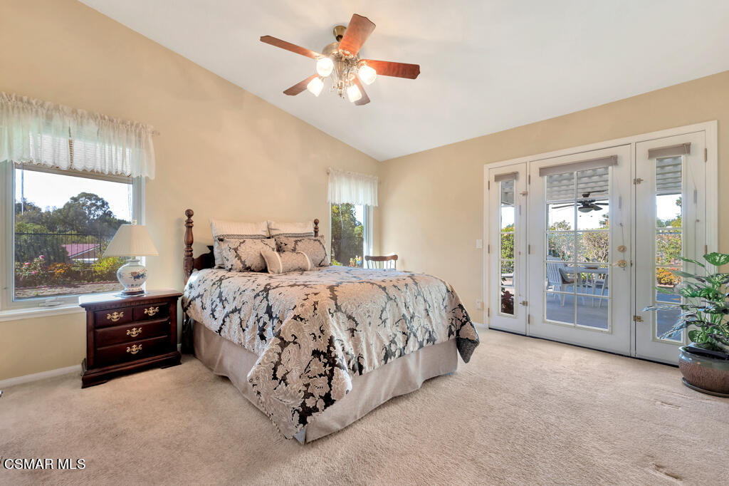 4331 Mill Valley Road Moorpark, CA 93021 - Photo 18 of 40 a spacious bedroom with a bed and a lamp with window