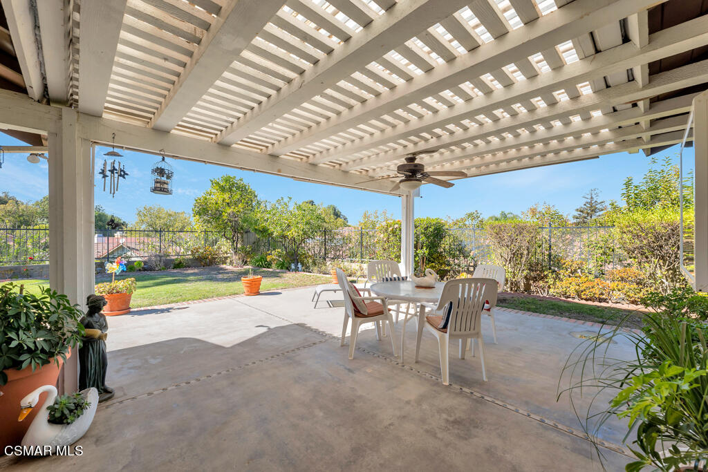 4331 Mill Valley Road Moorpark, CA 93021 - Photo 29 of 40 a view of a patio with a table and chairs under an umbrella