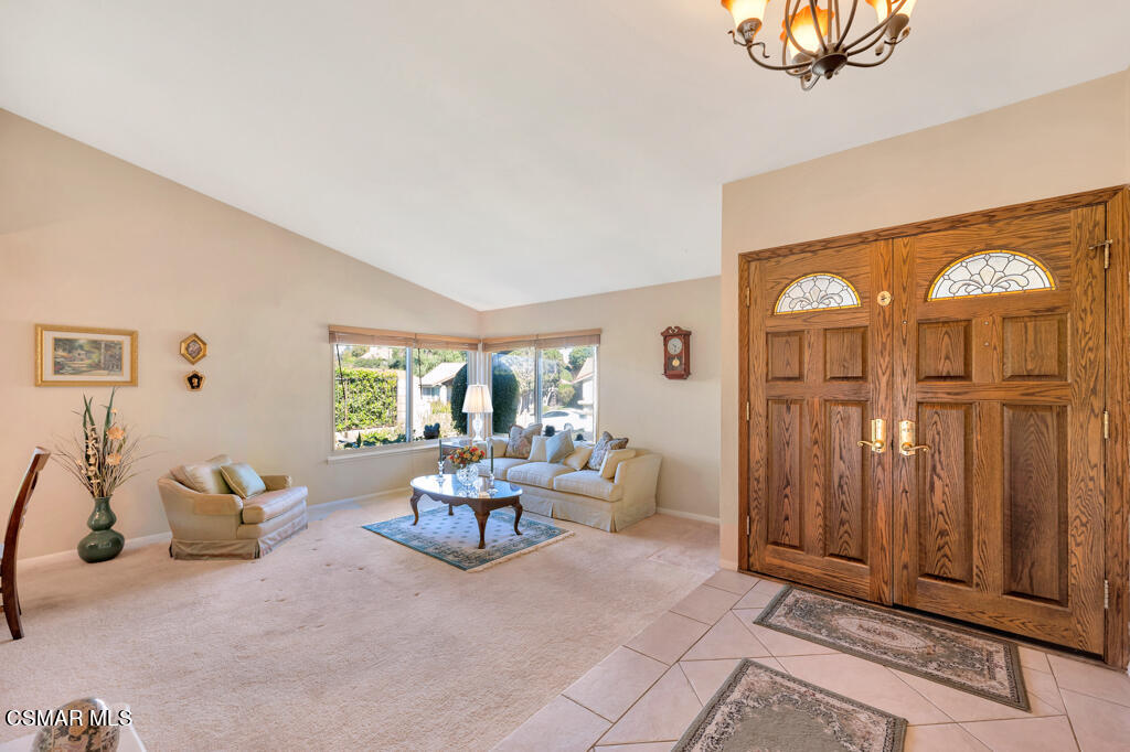 4331 Mill Valley Road Moorpark, CA 93021 - Photo 6 of 40 a living room with furniture a window and a chandelier