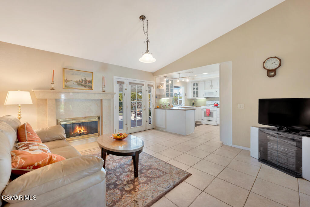 4331 Mill Valley Road Moorpark, CA 93021 - Photo 8 of 40 a living room with furniture a fireplace and a flat screen tv