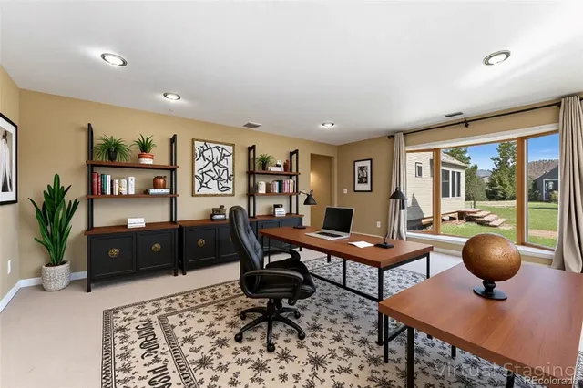 a workspace with furniture and window