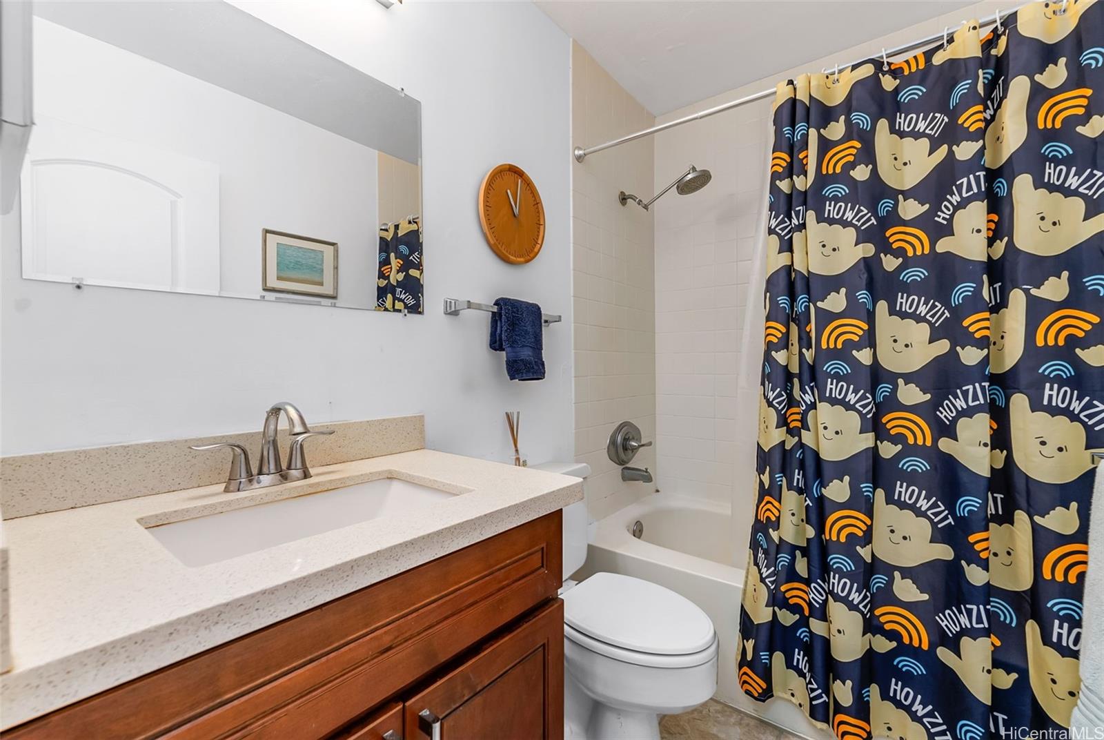 3045 Ala Napuaa Place, Unit 1305 Honolulu, HI 96818 - Photo 11 of 18 a bathroom with a sink and a mirror