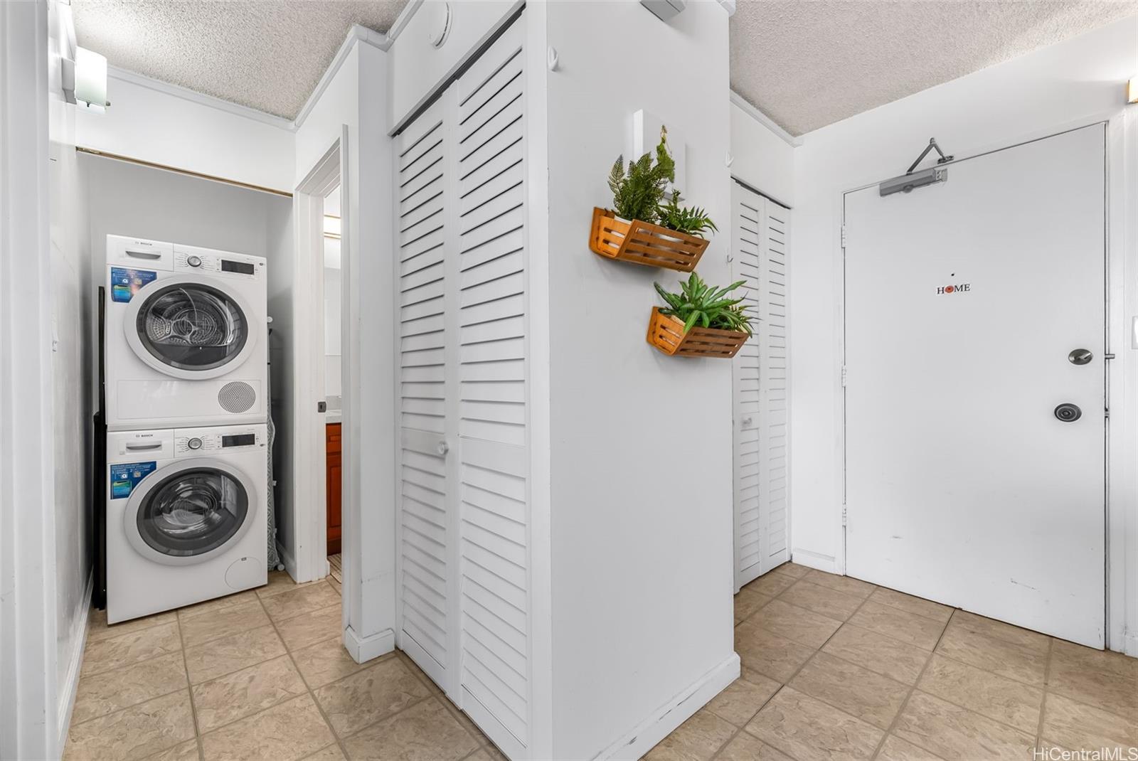 3045 Ala Napuaa Place, Unit 1305 Honolulu, HI 96818 - Photo 12 of 18 a utility room with dryer and washer