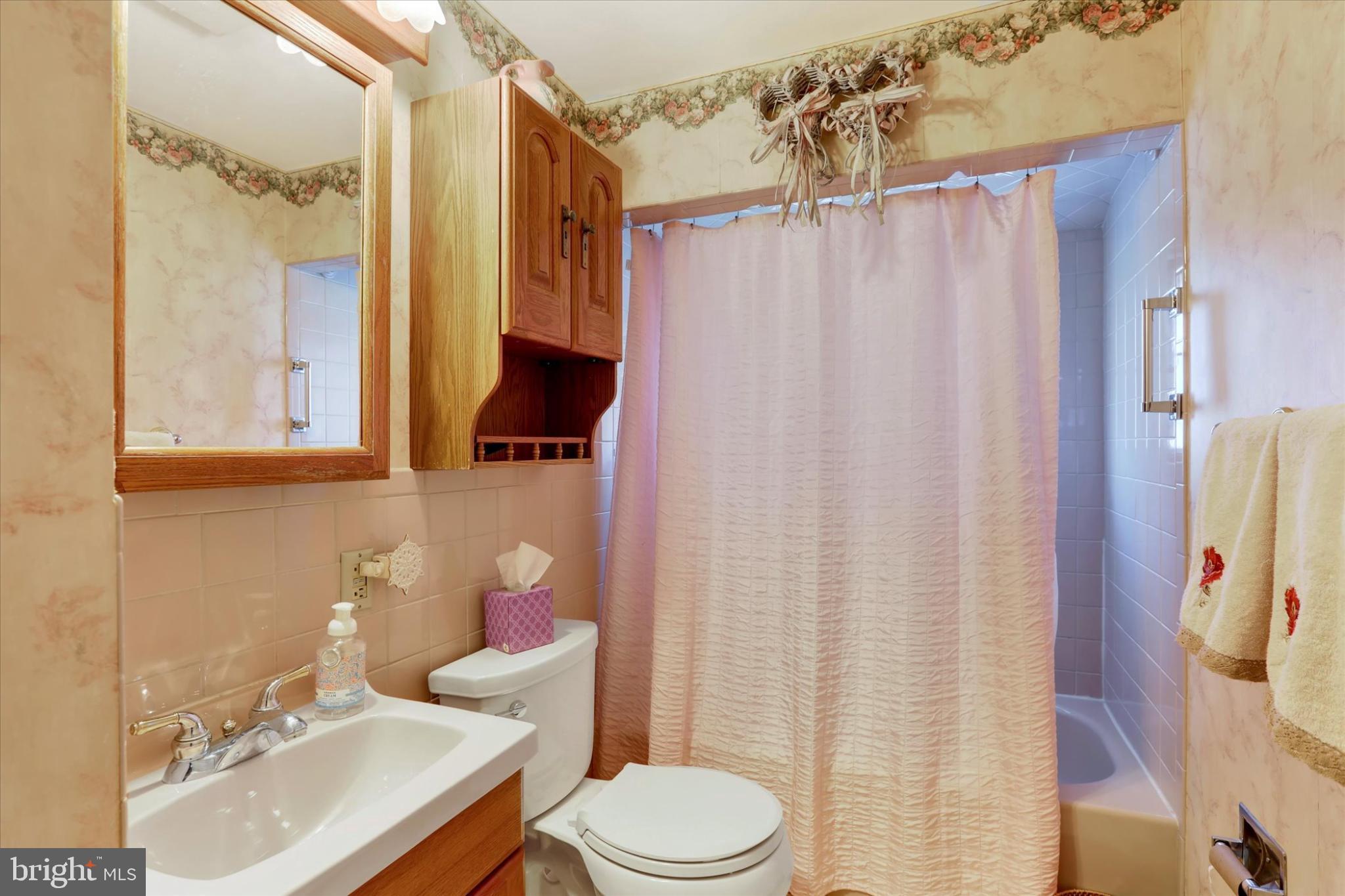 15 Cable Road Levittown, PA 19057 - Photo 11 of 16 Charming bathroom with vintage floral accents.