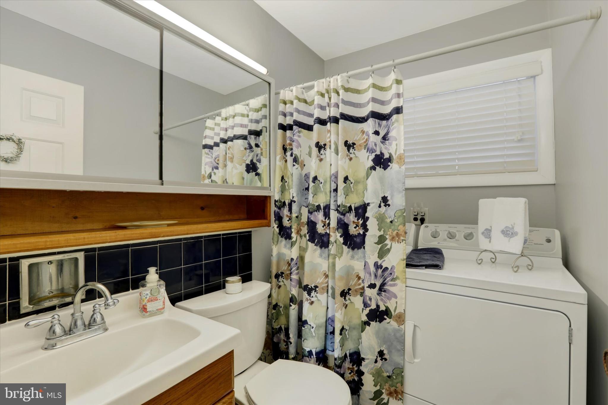 15 Cable Road Levittown, PA 19057 - Photo 14 of 16 Charming bathroom with floral accents.