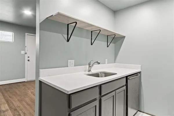a bathroom with a sink and mirror