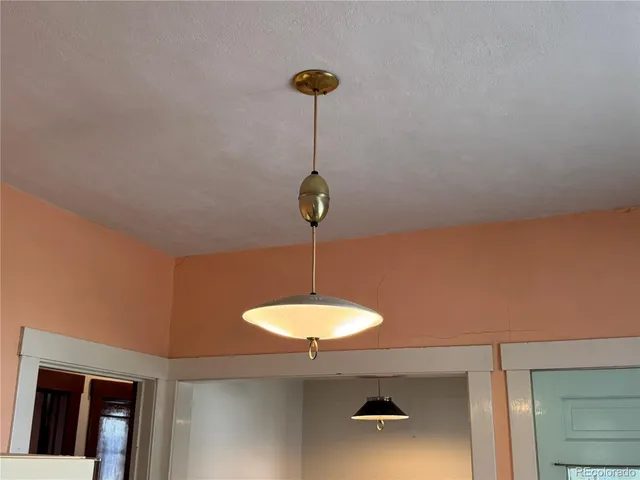 a lamp on a table and a chandelier