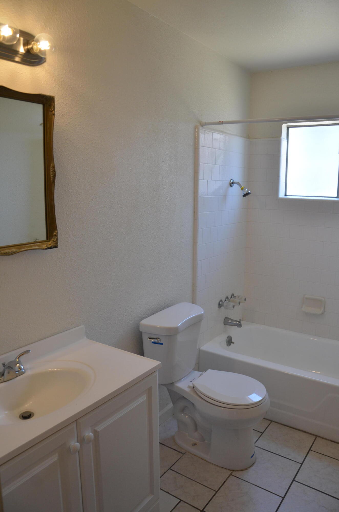 339 West Spring Lane Lemoore, CA 93245 - Photo 19 of 31 a bathroom with a toilet a sink and bathtub