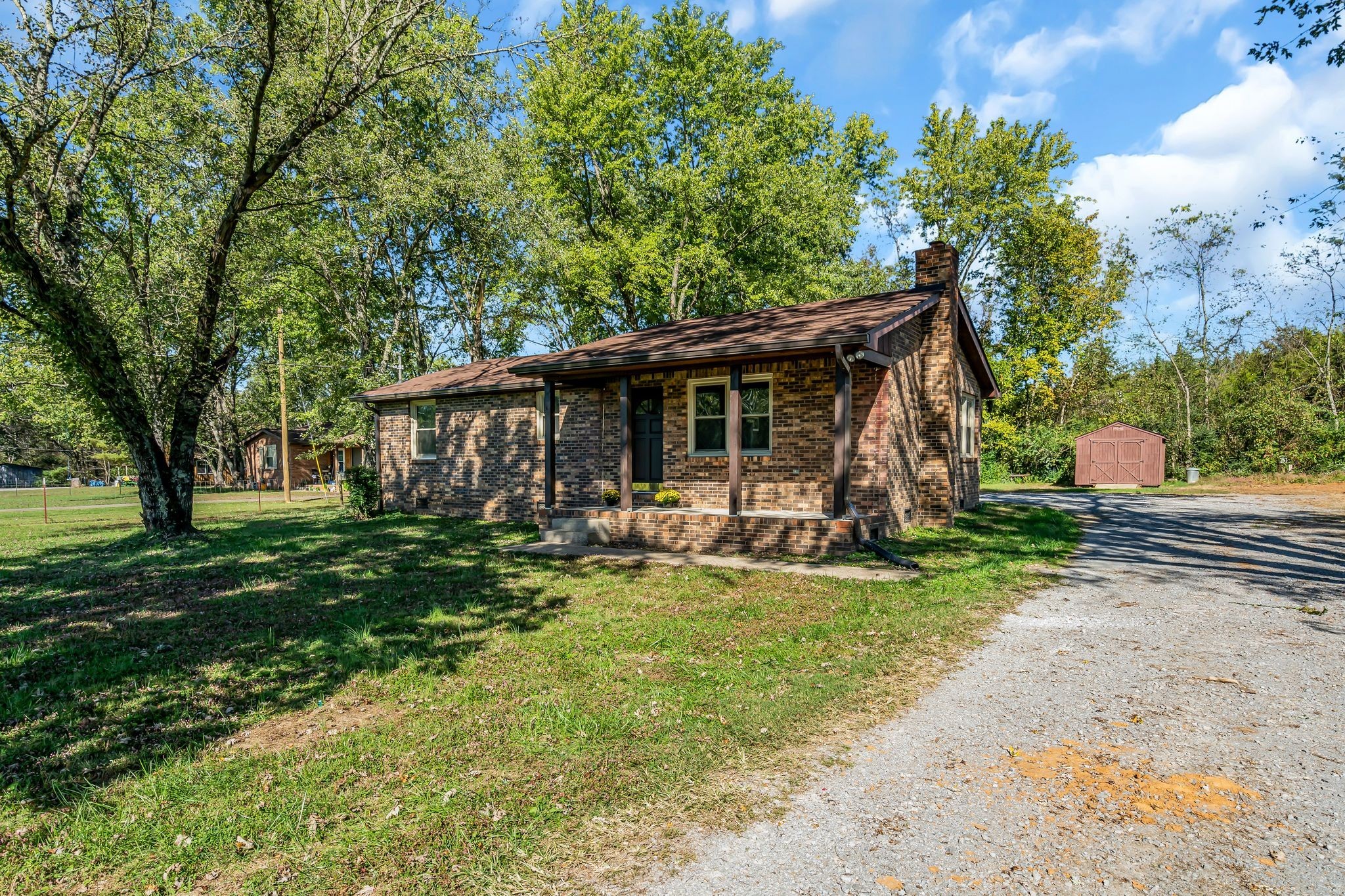 955 Hamilton Chambers Road Lebanon, TN 37087 - Photo 3 of 30 a view of a house with backyard porch and sitting area
