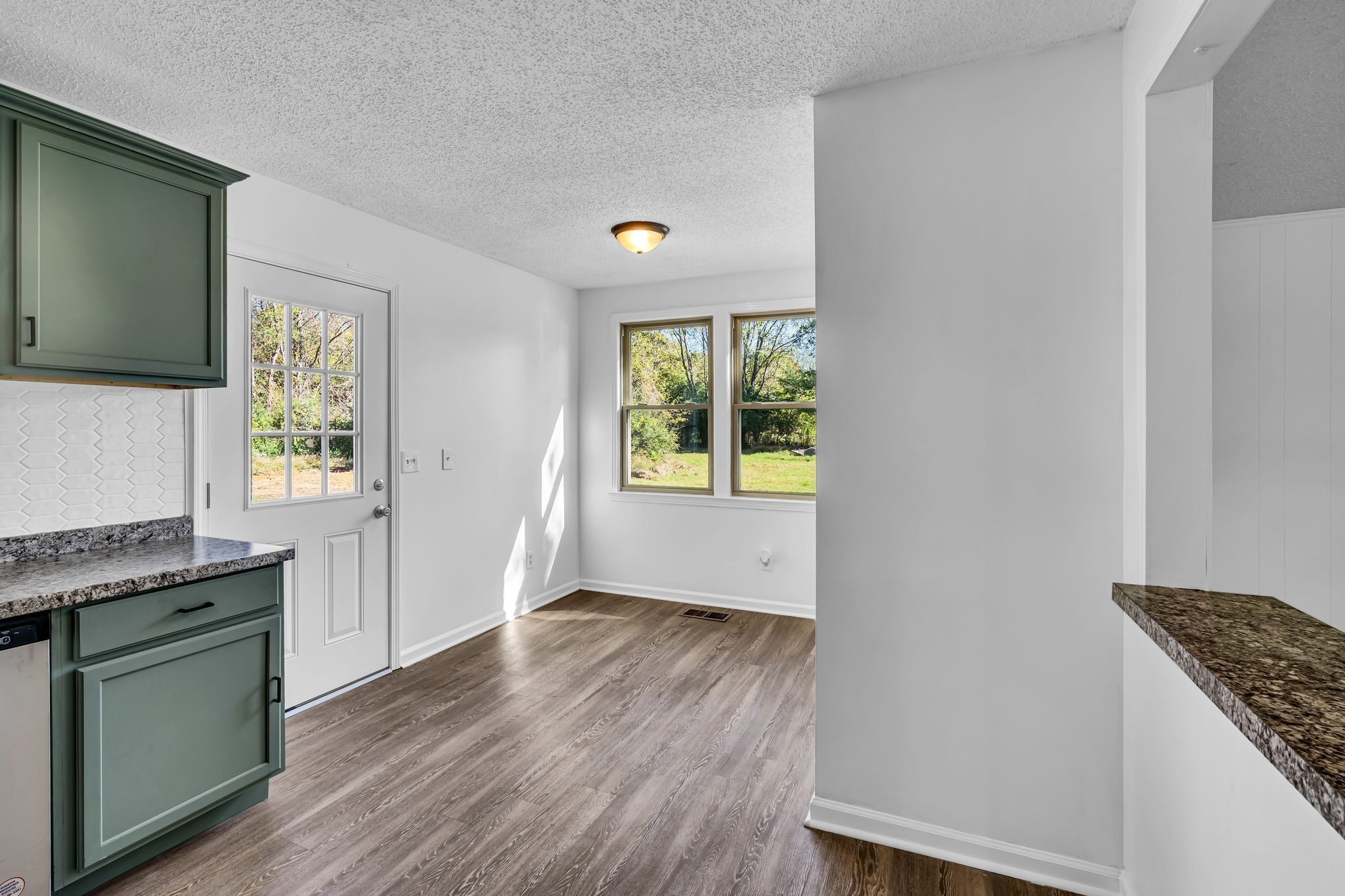 955 Hamilton Chambers Road Lebanon, TN 37087 - Photo 8 of 30 a kitchen with a wooden floor and a window