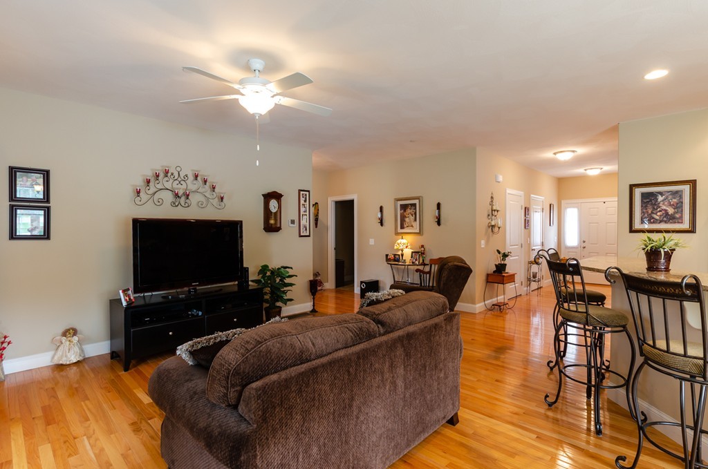 2 Thorn Hill Road, Unit 2 Hooksett, NH 03106 - Photo 14 of 27 a living room with furniture and a flat screen tv