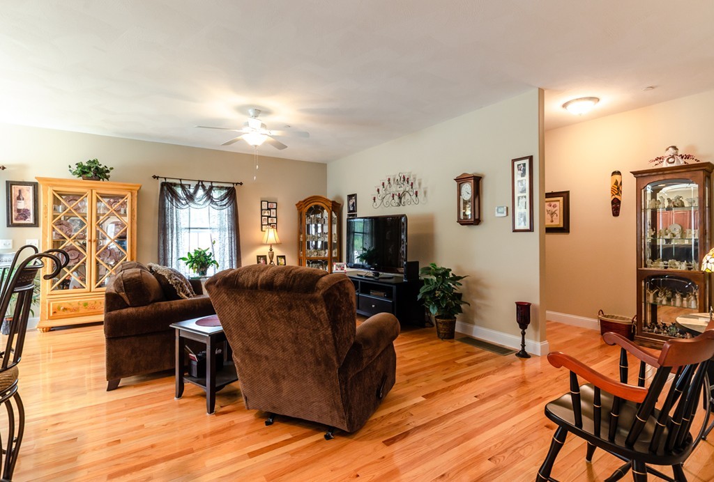 2 Thorn Hill Road, Unit 2 Hooksett, NH 03106 - Photo 15 of 27 a living room with furniture and wooden floor