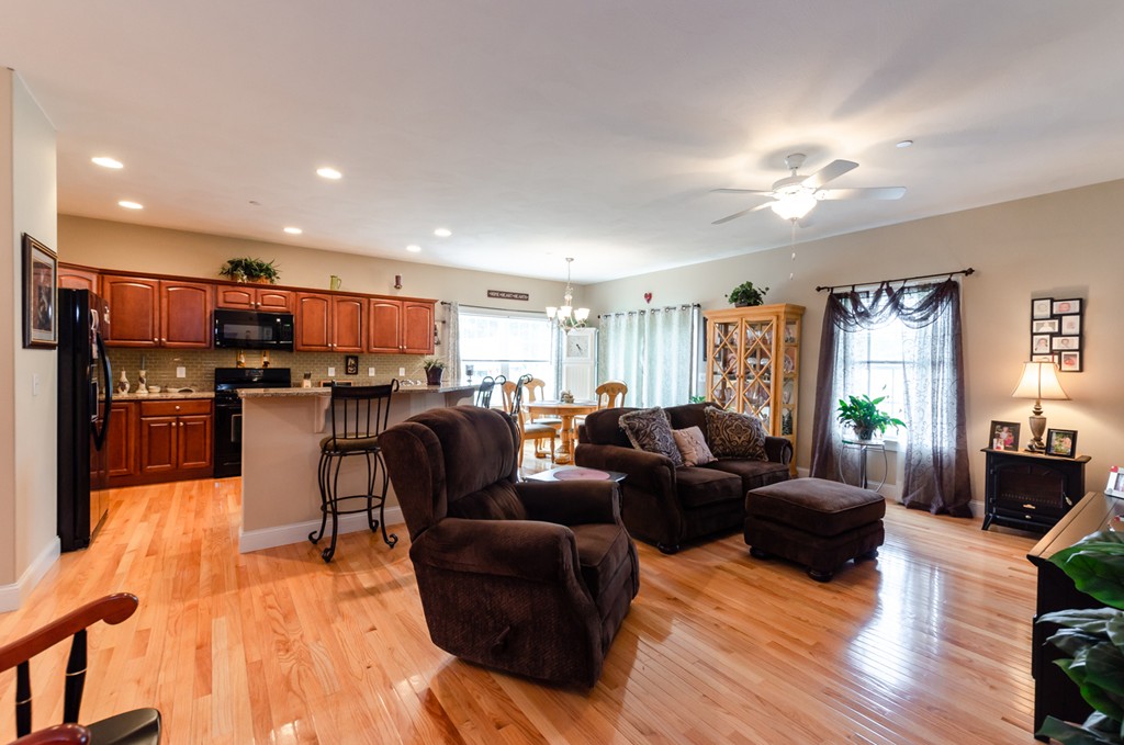 2 Thorn Hill Road, Unit 2 Hooksett, NH 03106 - Photo 16 of 27 a living room with furniture kitchen and a wooden floor