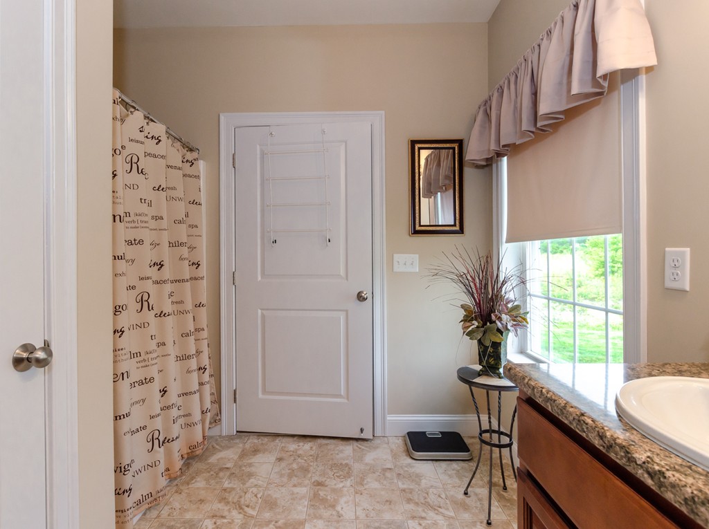 2 Thorn Hill Road, Unit 2 Hooksett, NH 03106 - Photo 21 of 27 a view of a livingroom with furniture and windows