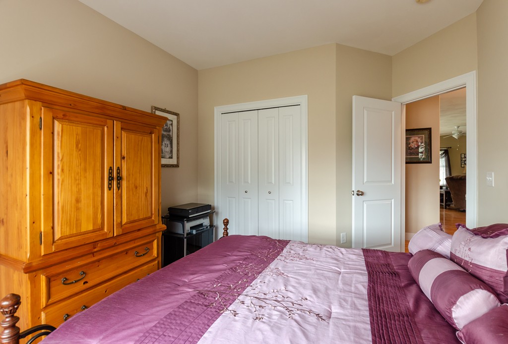 2 Thorn Hill Road, Unit 2 Hooksett, NH 03106 - Photo 6 of 27 a bedroom with a bed and furniture
