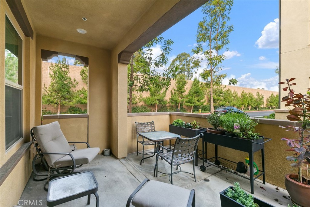 229 Carlow Irvine, CA 92618 - Photo 16 of 32 a balcony with chairs and a table