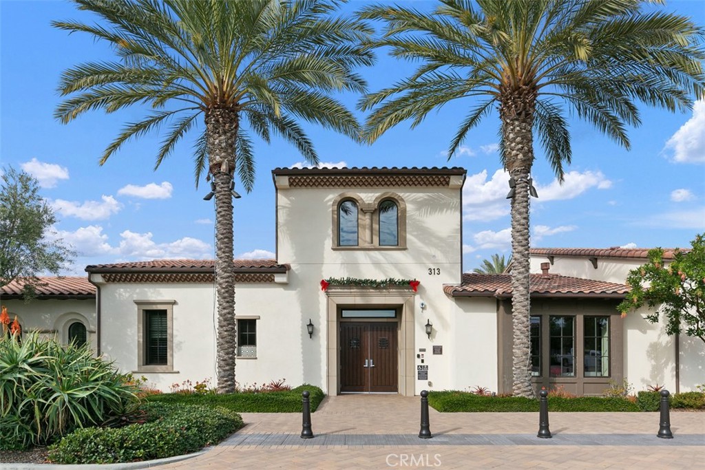 229 Carlow Irvine, CA 92618 - Photo 20 of 32 a front view of a house with a palm tree
