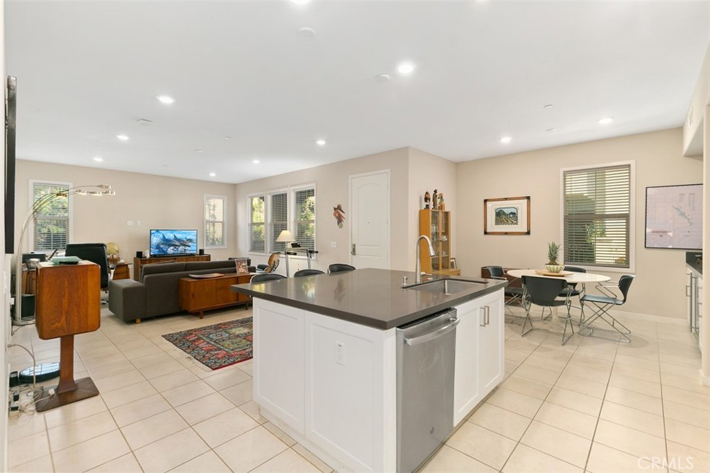 229 Carlow Irvine, CA 92618 - Photo 6 of 32 a kitchen with stainless steel appliances kitchen island granite countertop a sink and a counter top space
