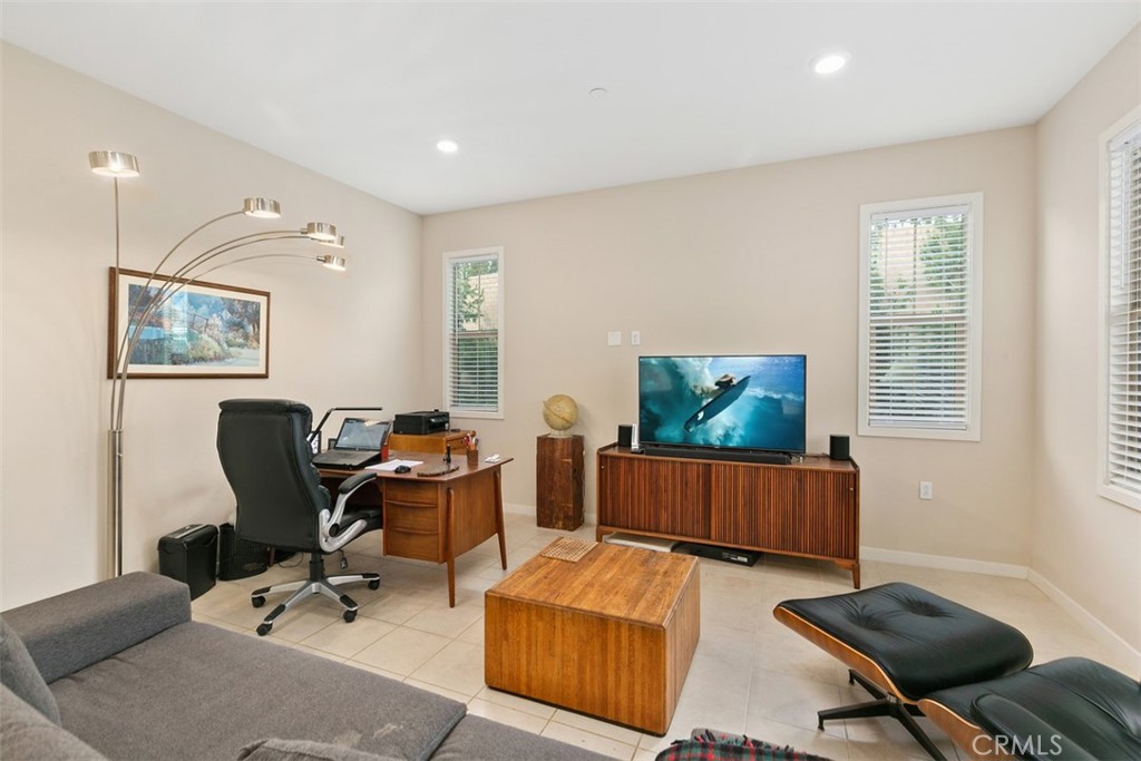 229 Carlow Irvine, CA 92618 - Photo 8 of 32 a living room with furniture and a flat screen tv