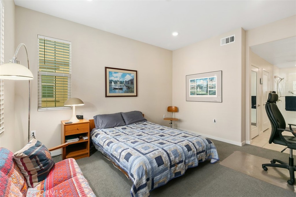229 Carlow Irvine, CA 92618 - Photo 10 of 32 a bedroom with a bed and wooden floor