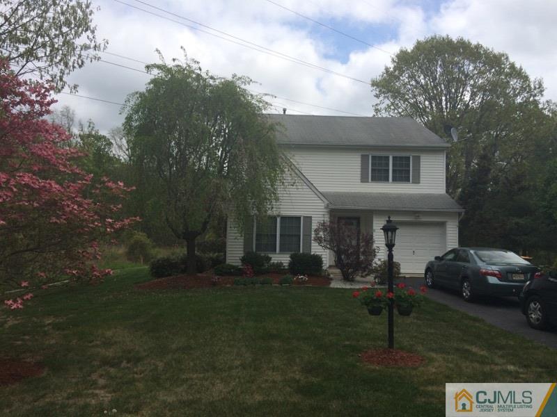 9 Westley Road Old Bridge, NJ 08857 - Photo 1 of 16 a front view of a house with garden