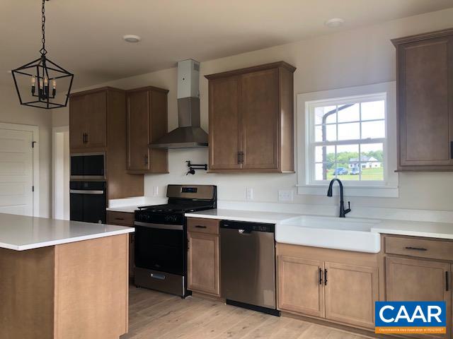 1847 Hollands Road Palmyra, VA 22963 - Photo 12 of 23 a kitchen with stainless steel appliances granite countertop a sink stove and refrigerator