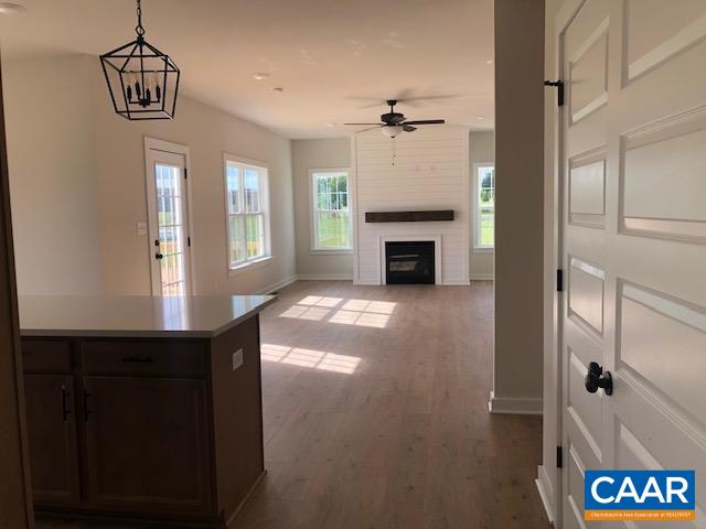 1847 Hollands Road Palmyra, VA 22963 - Photo 9 of 23 a view of an empty room with a fireplace and a window