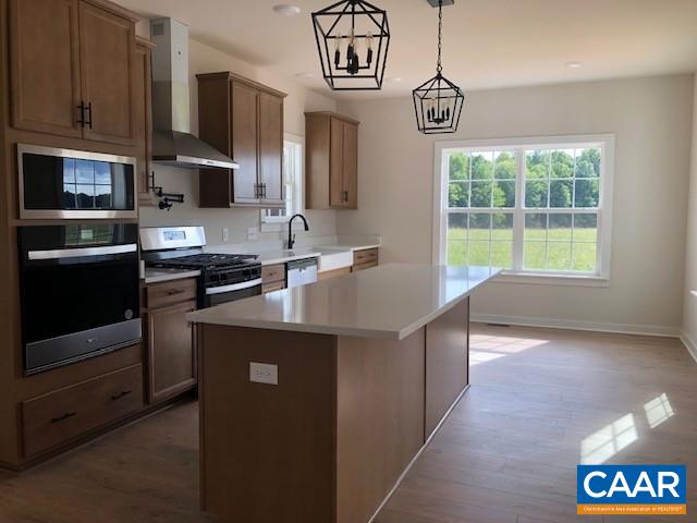 1847 Hollands Road Palmyra, VA 22963 - Photo 10 of 23 a kitchen with kitchen island granite countertop a stove a sink dishwasher and a microwave oven with cabinets
