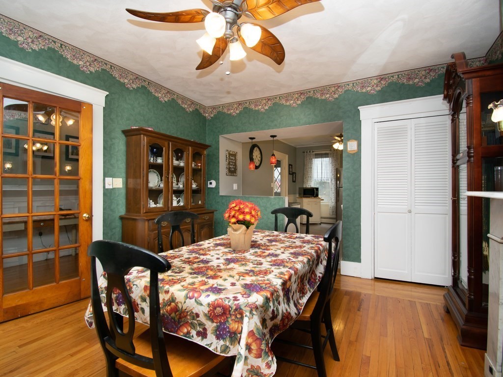 100 Elm Street Boston, MA 02129 - Photo 11 of 18 a view of a dining room with furniture window and wooden floor