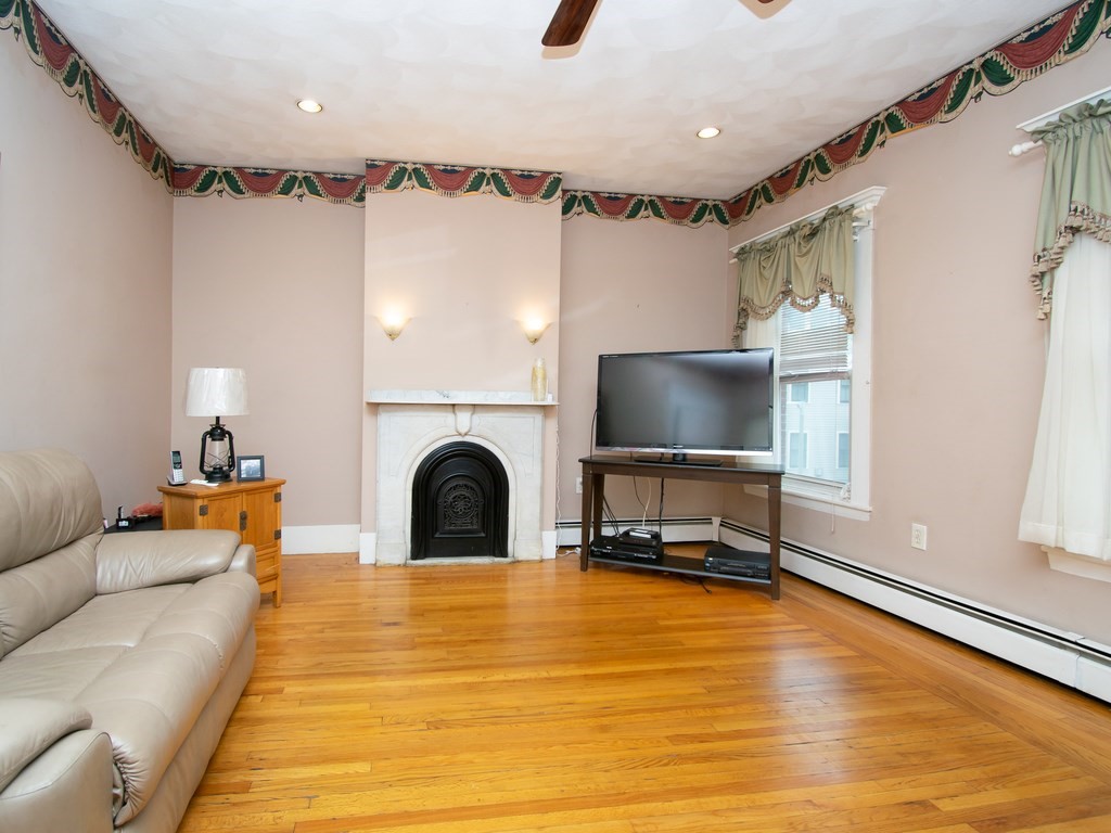 100 Elm Street Boston, MA 02129 - Photo 13 of 18 a living room with furniture and a flat screen tv