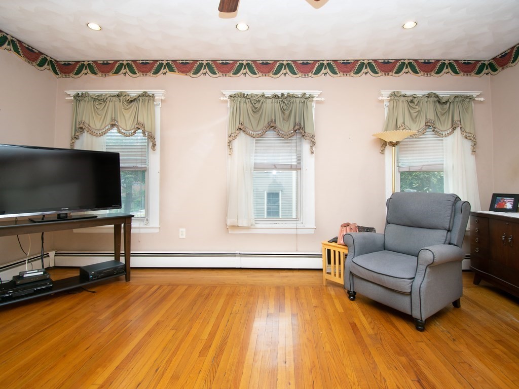 100 Elm Street Boston, MA 02129 - Photo 14 of 18 a living room with furniture and a flat screen tv