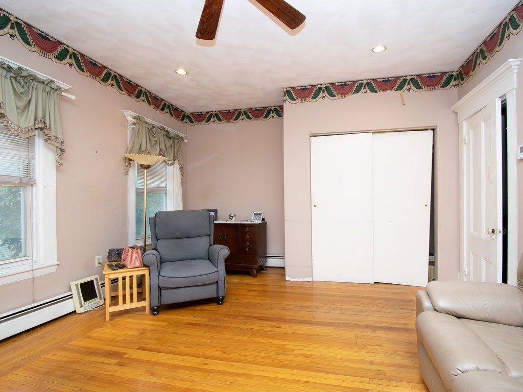 100 Elm Street Boston, MA 02129 - Photo 15 of 18 a bedroom with furniture and a window