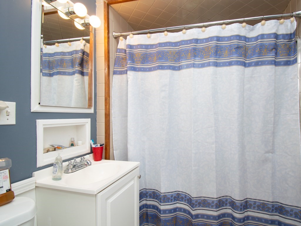 100 Elm Street Boston, MA 02129 - Photo 17 of 18 a bathroom with a sink and a mirror