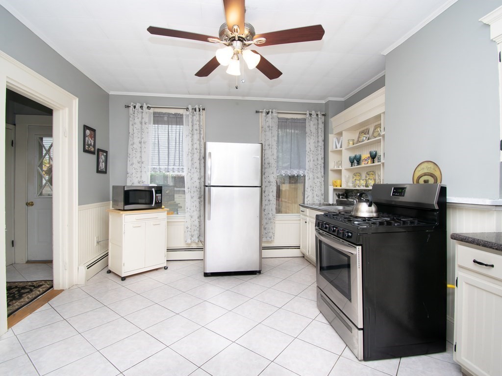 100 Elm Street Boston, MA 02129 - Photo 4 of 18 a kitchen with a refrigerator and a stove