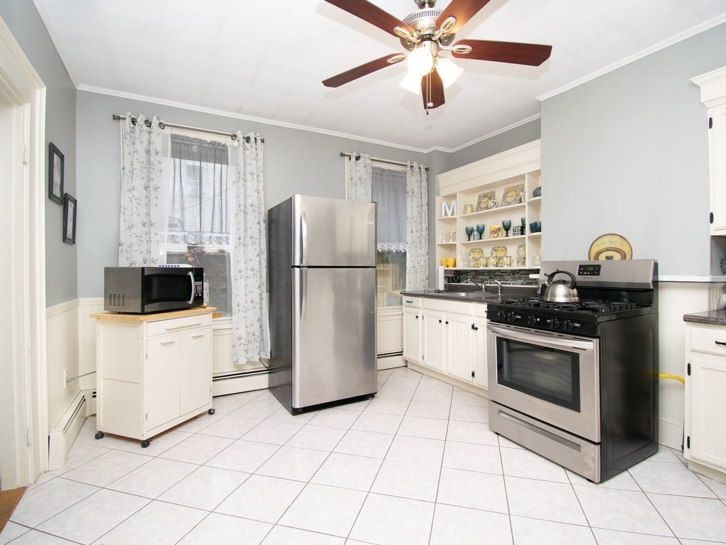 100 Elm Street Boston, MA 02129 - Photo 5 of 18 a kitchen with a stove a refrigerator and a sink