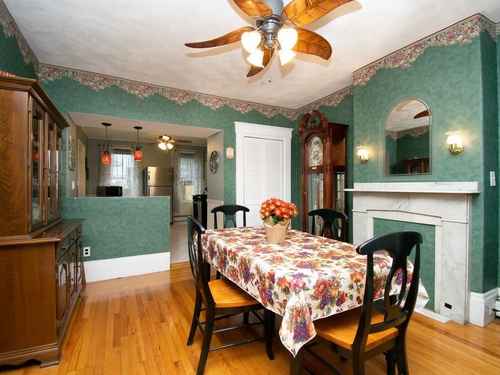 100 Elm Street Boston, MA 02129 - Photo 9 of 18 a view of a dining room with furniture and chandelier